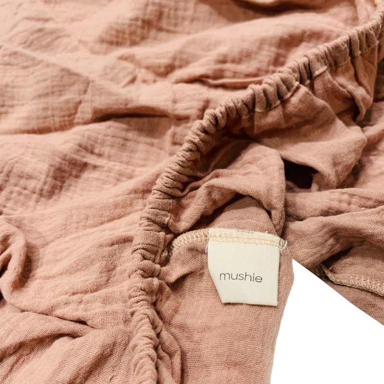 Mushie-Extra-Soft-Muslin-Crib-Sheet-in-Blush-1-3