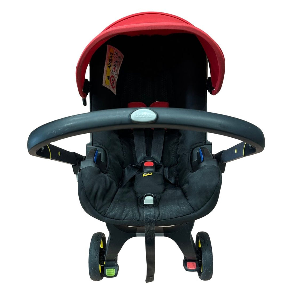doona red stroller Doona Stroller - Flame Red with Footmuff, Newborn Insert & Snap On Storage | Shop used Strollers in UAE